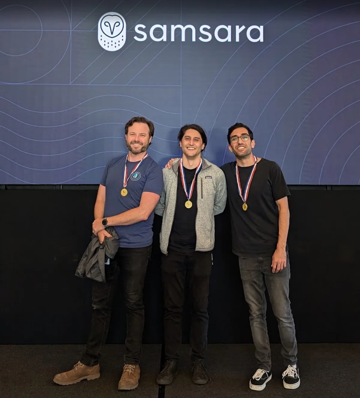 Bryan Burnett with teammates receiving a Samsara BizTech award